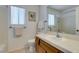 Bathroom with single sink, wood vanity and a framed painting offering both functionality and aesthetic appeal at 6436 Deadwood Rd, Las Vegas, NV 89108