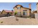 Stunning two-story home with stucco exterior, chimney, and a rock landscaped yard ideal for enjoying outdoor living at 6436 Deadwood Rd, Las Vegas, NV 89108