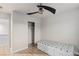 Cozy bedroom features a ceiling fan, built-in bed with storage, and closet at 6525 Raven Hall St, North Las Vegas, NV 89084