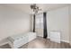 Comfortable bedroom includes a bed with storage, closet, and a window at 6525 Raven Hall St, North Las Vegas, NV 89084