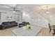 Open-concept living room showing stairs, and kitchen at 6525 Raven Hall St, North Las Vegas, NV 89084
