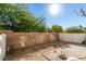 Backyard featuring a brick wall, some trees, gravel, and an outdoor brick patio at 6549 Clara Bow Ave # 103, Las Vegas, NV 89122