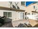 Backyard featuring a brick patio, gravel, a white fence, and an AC unit at 6549 Clara Bow Ave # 103, Las Vegas, NV 89122