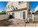 Backyard featuring a brick patio, gravel, and a white fence at 6549 Clara Bow Ave # 103, Las Vegas, NV 89122