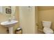 This bathroom has a white toilet and sink with neutral color walls at 6549 Clara Bow Ave # 103, Las Vegas, NV 89122