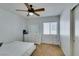 Bright bedroom with a ceiling fan, large window with blinds, white walls, and carpet floors at 6549 Clara Bow Ave # 103, Las Vegas, NV 89122