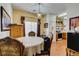 This dining room has an adjacent kitchen and a table with ornate wooden chairs at 6549 Clara Bow Ave # 103, Las Vegas, NV 89122