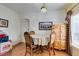 This dining room features a round table with decorative chairs and an armoire at 6549 Clara Bow Ave # 103, Las Vegas, NV 89122