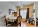 This dining area features a round table with ornate chairs and wood style flooring at 6549 Clara Bow Ave # 103, Las Vegas, NV 89122