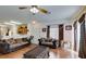 Comfortable living room with hardwood floors, ceiling fan, and natural light from the nearby windows at 6549 Clara Bow Ave # 103, Las Vegas, NV 89122