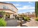 Backyard oasis with a beautiful water fountain, lush plants, and an inviting patio space perfect for outdoor relaxation at 7083 Seat Wall Rd, Las Vegas, NV 89148