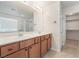 Bathroom features dual sinks, vanity, and walk-in closet at 7083 Seat Wall Rd, Las Vegas, NV 89148