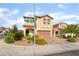 Charming two-story home with a brick driveway and well-maintained landscaping in a residential neighborhood at 7083 Seat Wall Rd, Las Vegas, NV 89148