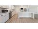 Modern kitchen featuring stainless steel appliances, an island and white cabinetry at 7083 Seat Wall Rd, Las Vegas, NV 89148