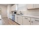 Well-lit kitchen with modern appliances, white countertops and cabinets, and stainless steel accents at 7083 Seat Wall Rd, Las Vegas, NV 89148