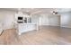 Spacious kitchen with white cabinets, stainless steel appliances, and an open view to the living area at 7083 Seat Wall Rd, Las Vegas, NV 89148