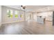 Bright living room featuring hardwood floors, recessed lighting, and a view of the kitchen at 7083 Seat Wall Rd, Las Vegas, NV 89148