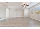 Large living room features modern ceiling fan, recessed lighting and plenty of natural light at 7083 Seat Wall Rd, Las Vegas, NV 89148