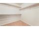 Spacious walk-in closet with carpet flooring and shelf and rod storage at 7083 Seat Wall Rd, Las Vegas, NV 89148