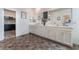 Bright bathroom features dual sinks and a view to the walk-in closet at 7107 Calvert Cliffs St, North Las Vegas, NV 89084