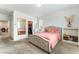 Comfortable bedroom featuring a queen-sized bed, closet, and ample natural light at 7107 Calvert Cliffs St, North Las Vegas, NV 89084