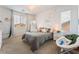 Cozy bedroom with large windows and a comfortable chair at 7107 Calvert Cliffs St, North Las Vegas, NV 89084