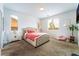 Cozy bedroom with plush furnishings, natural light, and decorative accents at 7107 Calvert Cliffs St, North Las Vegas, NV 89084