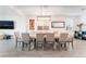 Spacious dining room features light tile floors, a large picture window, and ambient lighting at 7107 Calvert Cliffs St, North Las Vegas, NV 89084