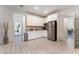 Well-lit kitchen with modern appliances, granite countertops, and ample cabinet space at 7107 Calvert Cliffs St, North Las Vegas, NV 89084