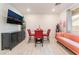 Contemporary living room with stylish furniture, dining area, and entertainment setup at 7107 Calvert Cliffs St, North Las Vegas, NV 89084