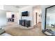 Spacious living room with TV, fireplace, and a view to the bathroom at 7107 Calvert Cliffs St, North Las Vegas, NV 89084