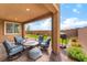 Outdoor patio area with comfortable seating, barbecue and artificial turf at 7107 Calvert Cliffs St, North Las Vegas, NV 89084