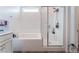 Beautiful tiled shower is featured in the bathroom with glass door at 7107 Calvert Cliffs St, North Las Vegas, NV 89084