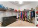 Large walk-in closet with custom shelving and plenty of storage space at 7107 Calvert Cliffs St, North Las Vegas, NV 89084