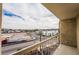 View from balcony overlooking the street and neighborhood, capturing blue skies and a hint of mountain views at 745 N Royal Crest Cir # 141, Las Vegas, NV 89169