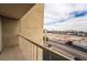 An outdoor balcony showing a view of the street and a vacant lot with mountain views in the distance at 745 N Royal Crest Cir # 141, Las Vegas, NV 89169
