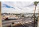 High angle view of a neighborhood and the street from the balcony, with palm trees in the foreground at 745 N Royal Crest Cir # 141, Las Vegas, NV 89169