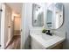 Bright bathroom features a modern sink with quartz countertop at 745 N Royal Crest Cir # 141, Las Vegas, NV 89169