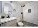 Elegant bathroom featuring marble-look tile in the shower and a modern sink with quartz countertop at 745 N Royal Crest Cir # 141, Las Vegas, NV 89169