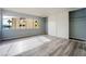 Light and airy bedroom with a large window, slider closet, and laminate floors at 745 N Royal Crest Cir # 141, Las Vegas, NV 89169