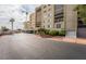 Exterior view of the multi-story building featuring a guarded entry at 745 N Royal Crest Cir # 141, Las Vegas, NV 89169
