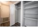 Bright hall closet features shelving and new laminate flooring at 745 N Royal Crest Cir # 141, Las Vegas, NV 89169