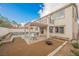 Exterior of a two-story house with a patio, pool, pergola, and landscaped yard at 7466 Matilda St, Las Vegas, NV 89113