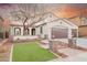 Charming two-story home with a well-manicured lawn, desert landscaping, and a three-car garage at 7466 Matilda St, Las Vegas, NV 89113