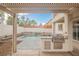Backyard patio with a pergola, built in BBQ, pool, and spa at 7466 Matilda St, Las Vegas, NV 89113