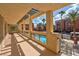 Spacious balcony overlooking the pool with shaded overhead covering and beautiful views at 75 E Agate Ave # 206, Las Vegas, NV 89123