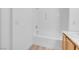 Bathroom showcasing tub and shower combo, white tile surround at 75 E Agate Ave # 206, Las Vegas, NV 89123