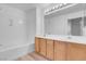 Bathroom with double sink vanity and bright vanity lights at 75 E Agate Ave # 206, Las Vegas, NV 89123