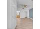 Spacious bedroom with stylish flooring, ceiling fan, and view to ensuite at 75 E Agate Ave # 206, Las Vegas, NV 89123