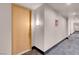 Hallway leading to unit with modern lighting and carpeted floors at 75 E Agate Ave # 206, Las Vegas, NV 89123